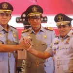 Foto : Momen saat Menkumham Yasonna Laoly melantik Silmy Karim sebagai Dirjen Imigrasi di era Presiden Jokowi.